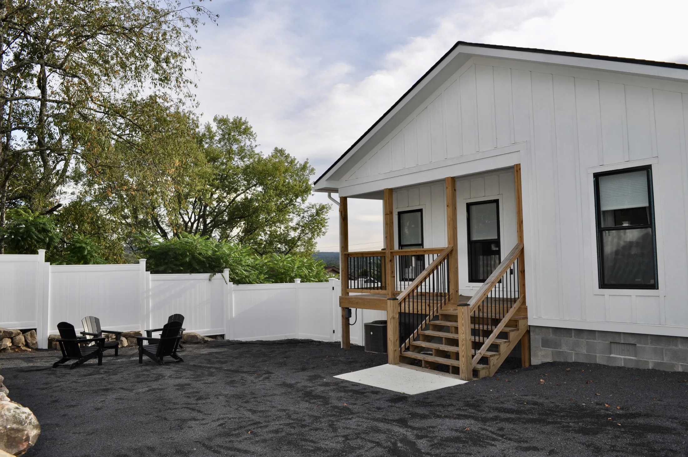 Covered porch with Adirondack chairs and Canaan Valley views at Stag & Stone